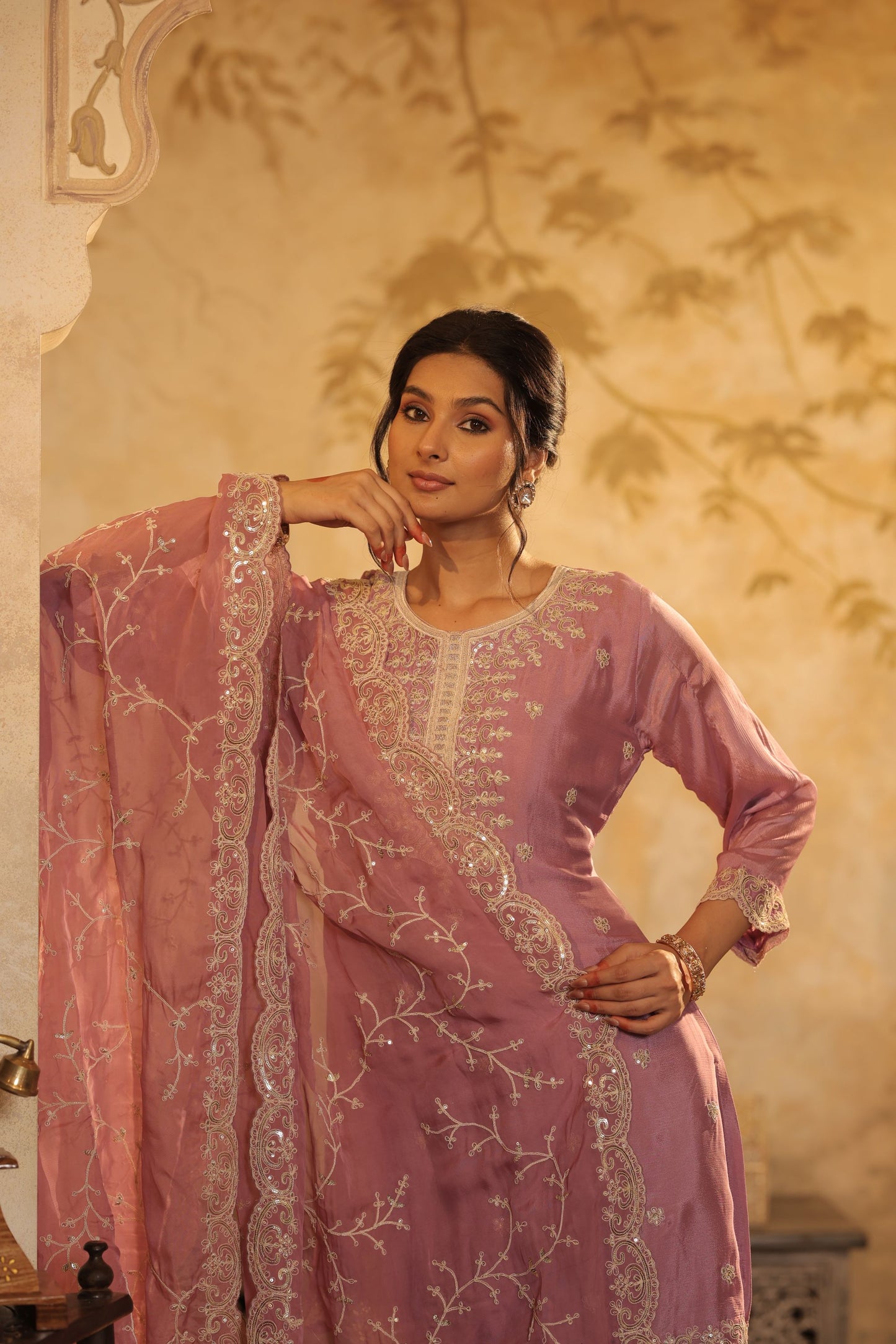 Pastel Mauve Suit Features Delicate Thread And Zari Embroidery With Lace Detailing With Shimmer